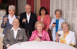 The writer’s mom, Babe Giese (sitting, in middle), enjoys a nightcap with friends (top row, from left) Blanche Abramson, Milton “Mitty” Tartakov, Elma Colindres, Flo Selber, (front, from left) Hymie Abramson and Geneva Carter.
