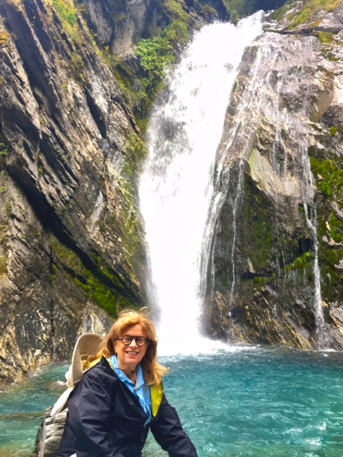 Enjoying the cool mist of the waterfall.