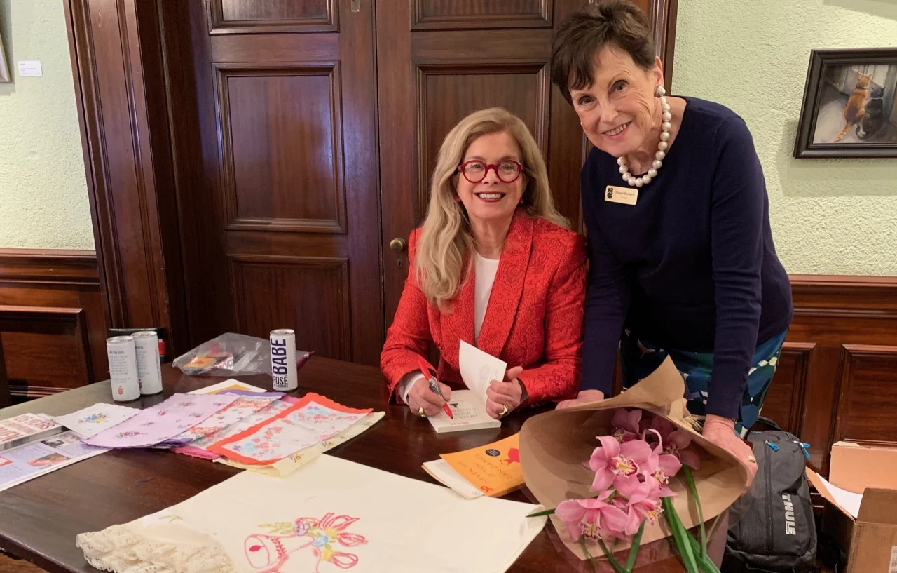 Author Jo Giese (left) with Ebell President Ginger Barnard, signed her book “Never Sit When You Can Dance,” filled with lessons she learned from her mother.
