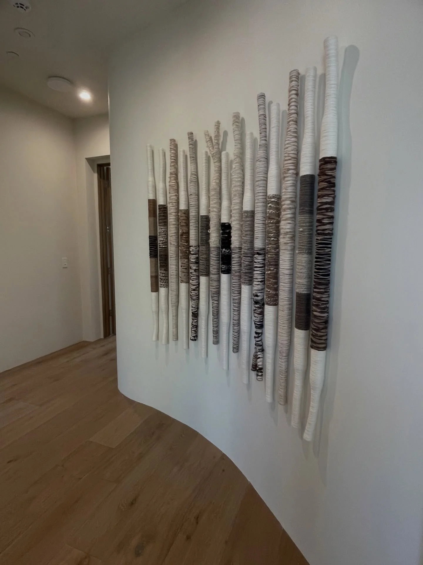 Installed work.
A quiet rhythm of texture, balance and movement&mdash;each element placed with intention to create harmony within the space.
This piece was designed to live with the architecture, not compete with it.
#textileart #fiberart #contempora