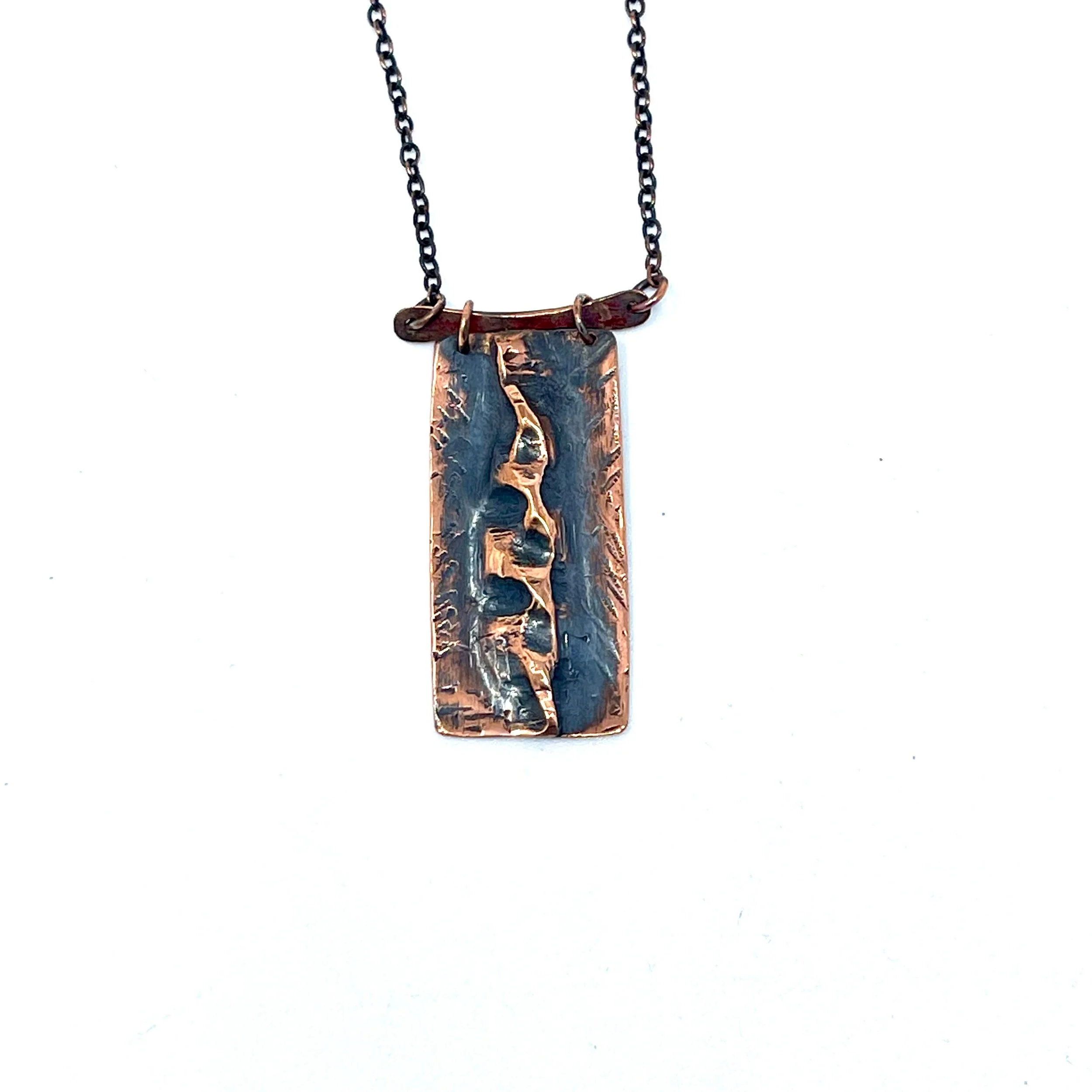 Handmade copper form fold metal work pendant — $60