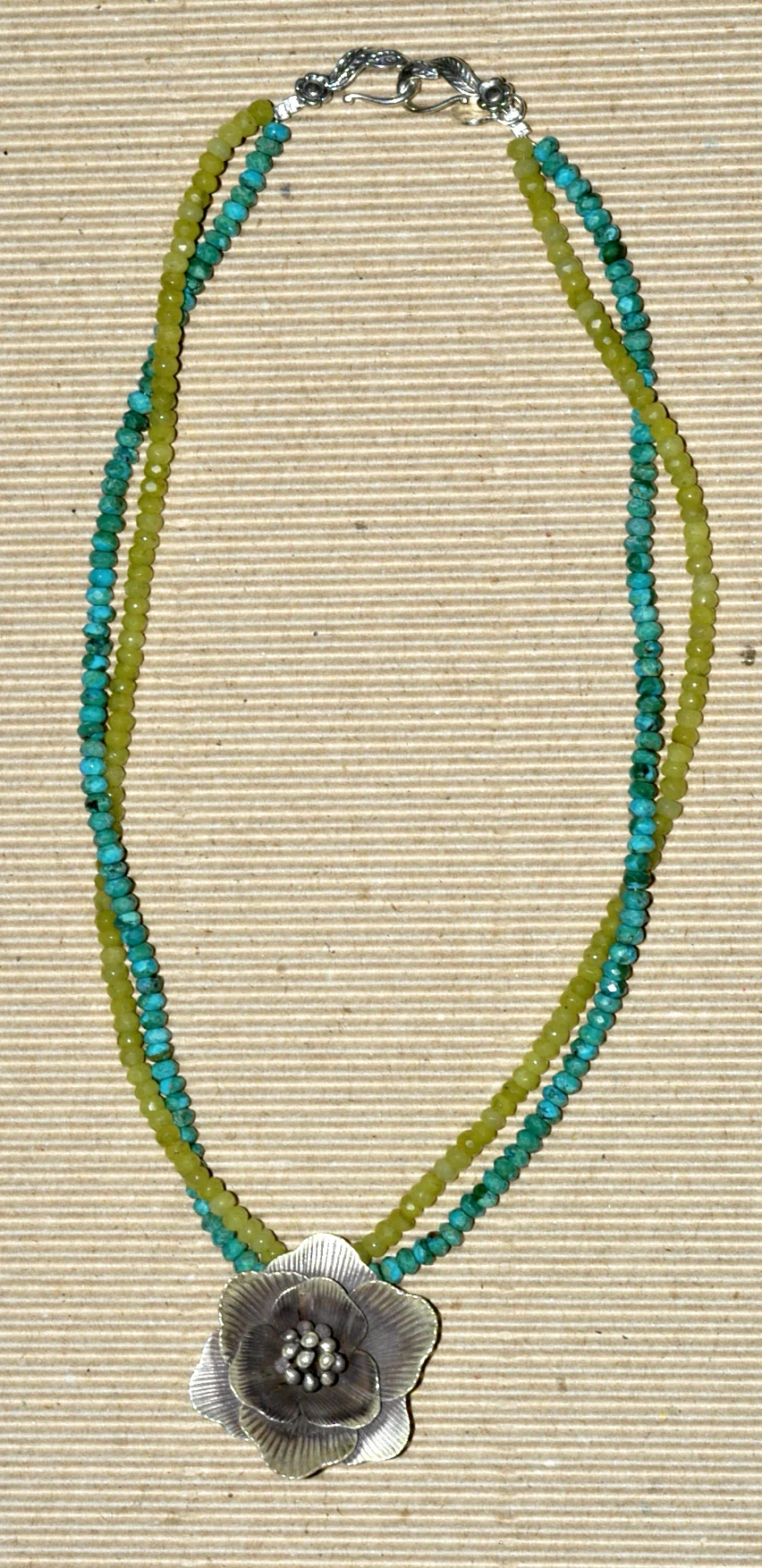 cut turquoise and olive jade with silver flower 58.00 a.jpg