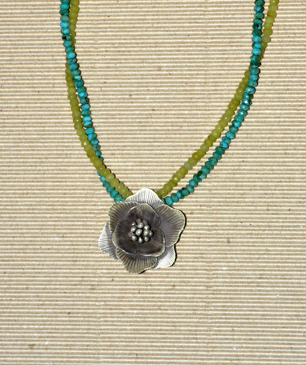cut turquoise and olive jade with silver flower closeup.jpg