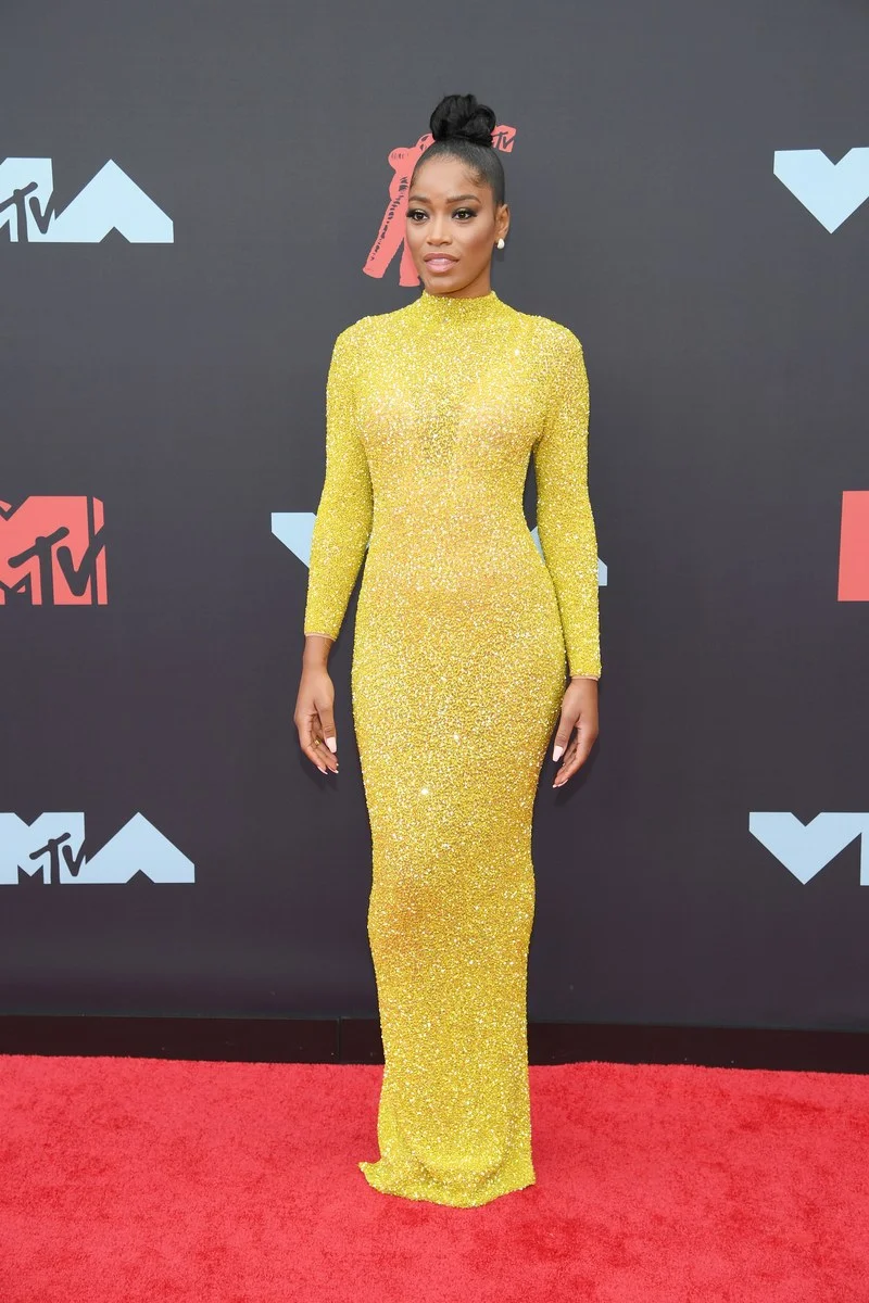 Keke stunned in this yellow couture piece and whipped out a chunky gold cell phone later on the carpet.