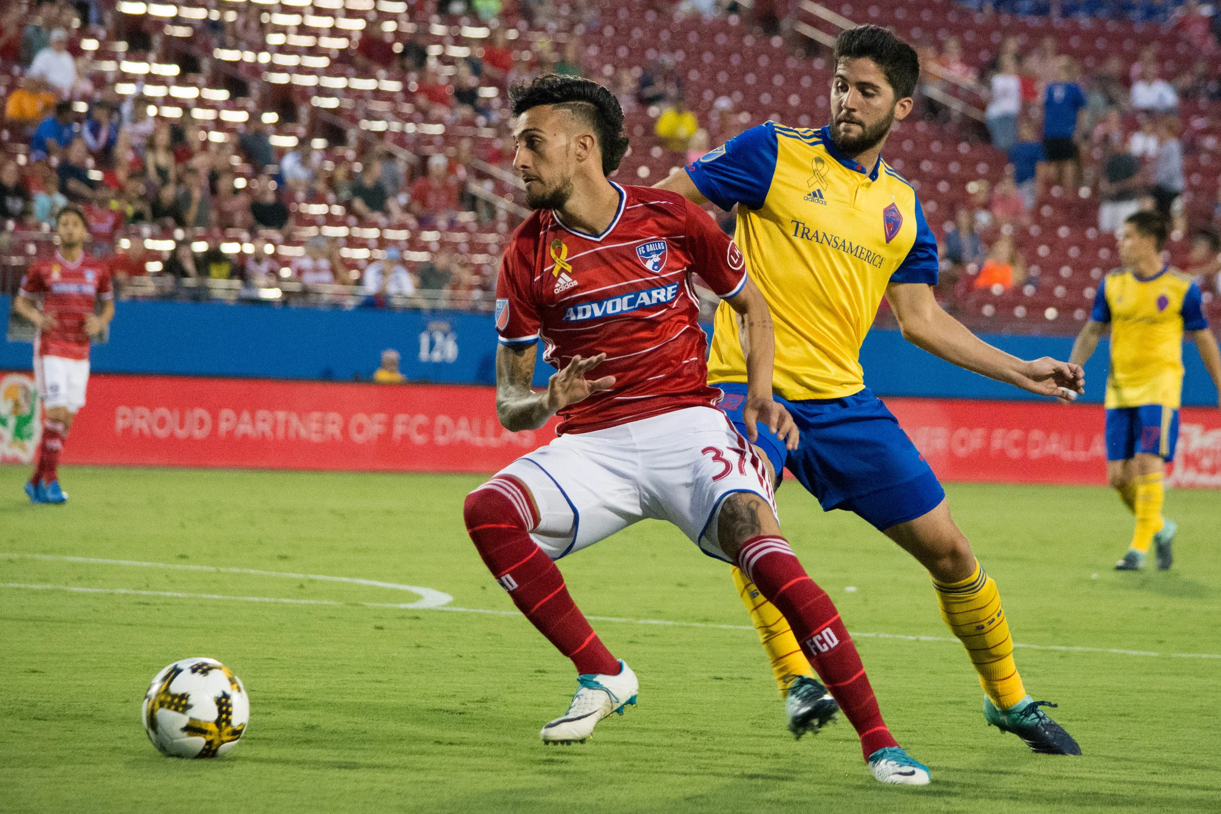 FC Dallas Maximiliano Urruti beats a Rapids defender Eric Miller.