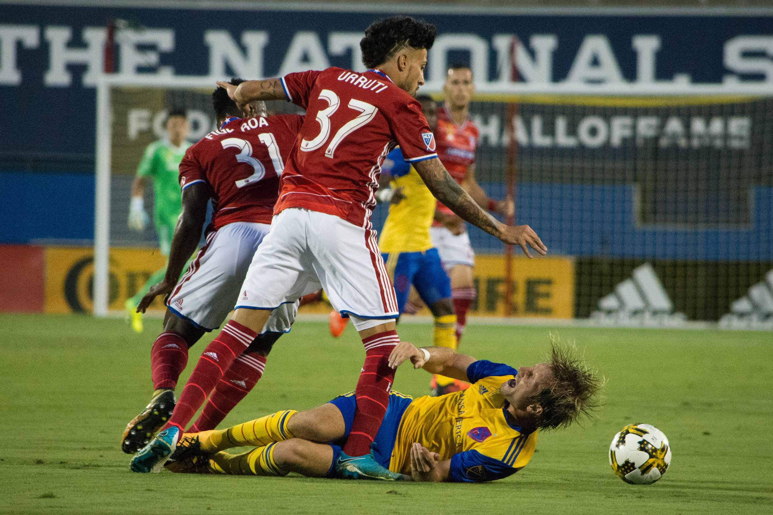 FC Dallas Maximiliano Urruti takes down a Rapids player