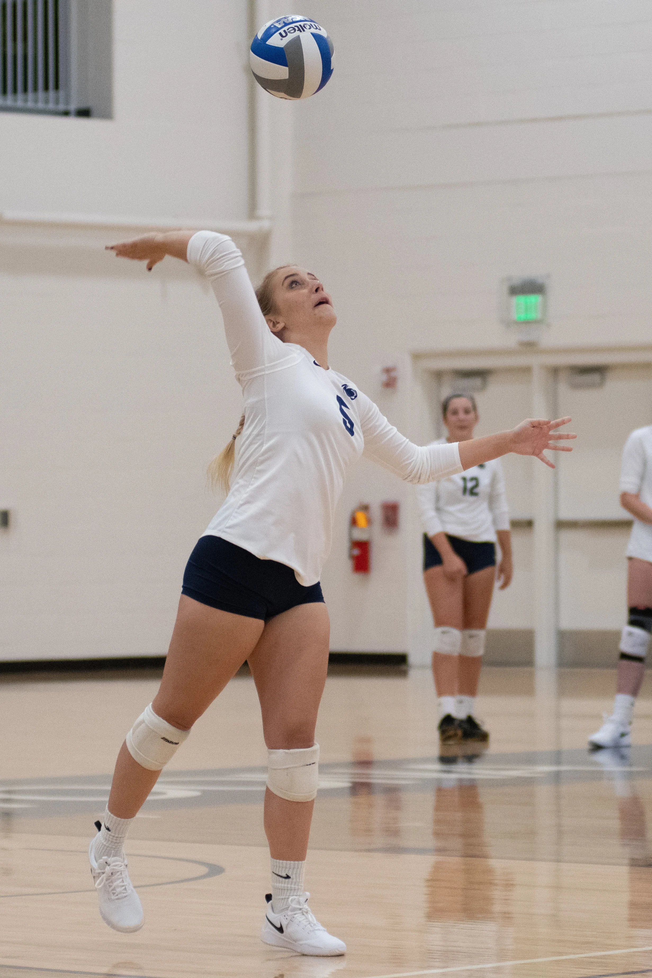Penn State Altoona Women’s Volleyball player Emily Bryan (#5) serves the ball in their 3-0 loss to Penn State Harrisburg.