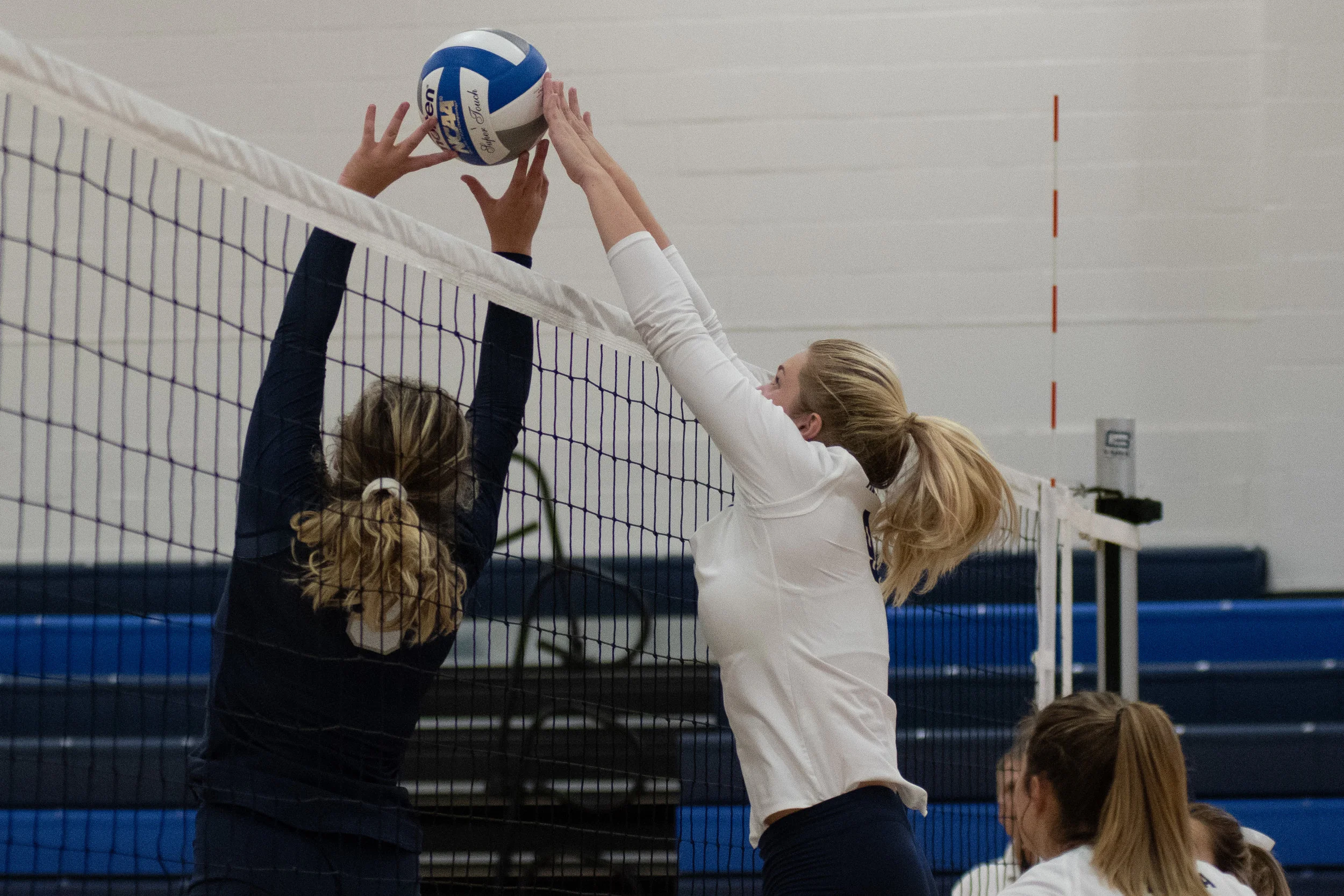 Penn State Altoona Women’s Volleyball player Alexis Cannistraci (#9) blocks a bump from Penn State Harrisburg player Kristin Waring (#5) in their 3-0 loss to Penn State Harrisburg.