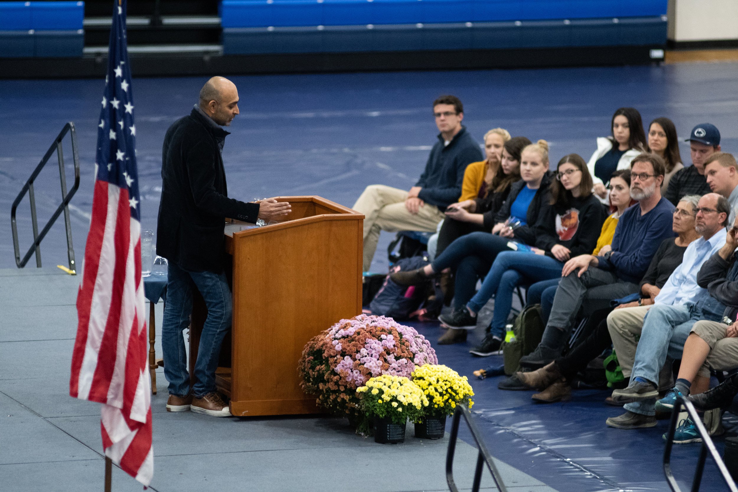 Photo by: Noah Riffe - Author Mohsin Hamid speaks on stage at Penn State Altoona's Adler Arena on September 25th, 2018. - Photo By: Noah Riffe