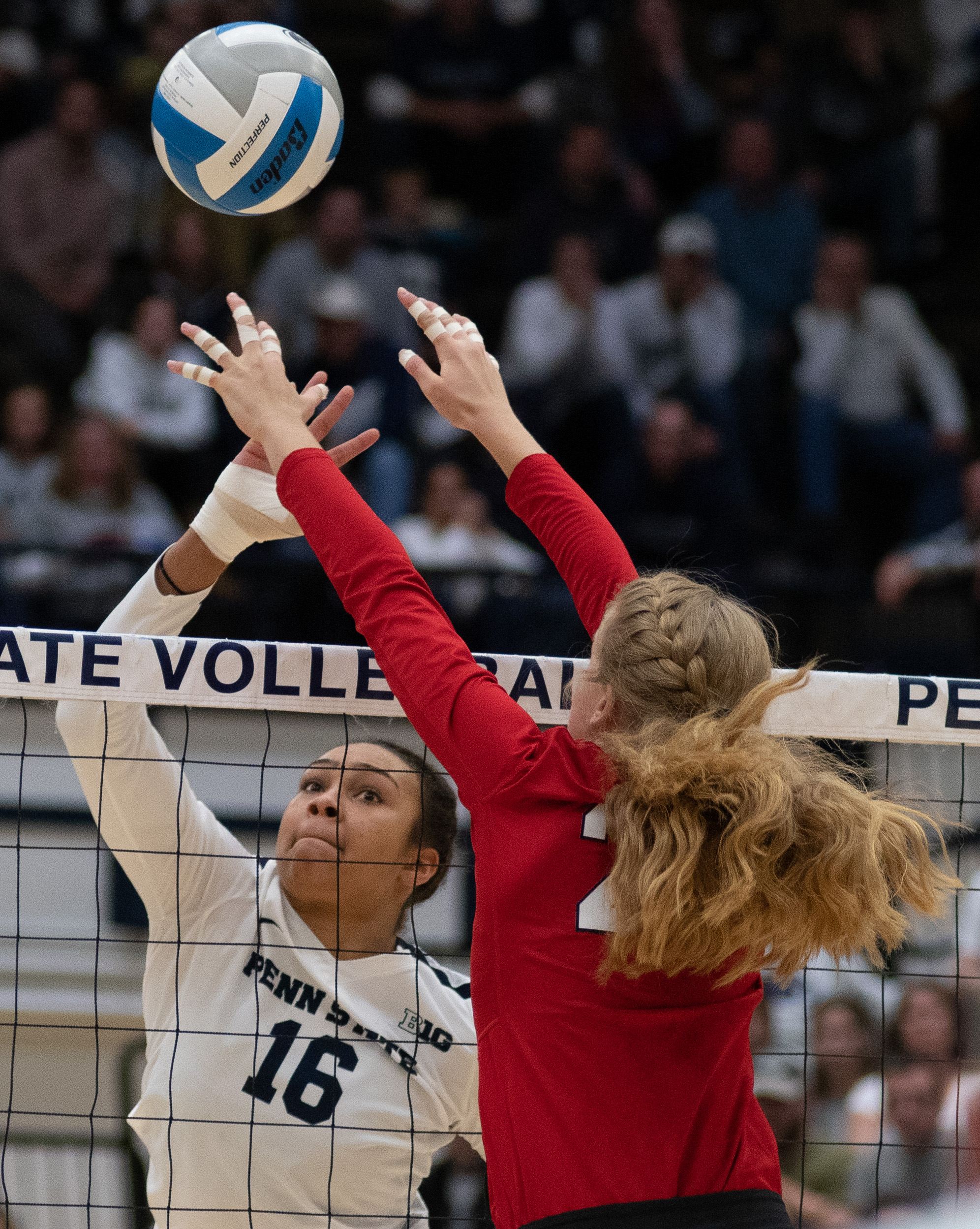 Middle blocker Serena Gray (16) spikes the ball during the game against Nebraska at Rec Hall on Saturday, October 13, 2018. The Nittany Lions defeat Nebraska in 3-2 sets. | Photo by: Noah Riffe