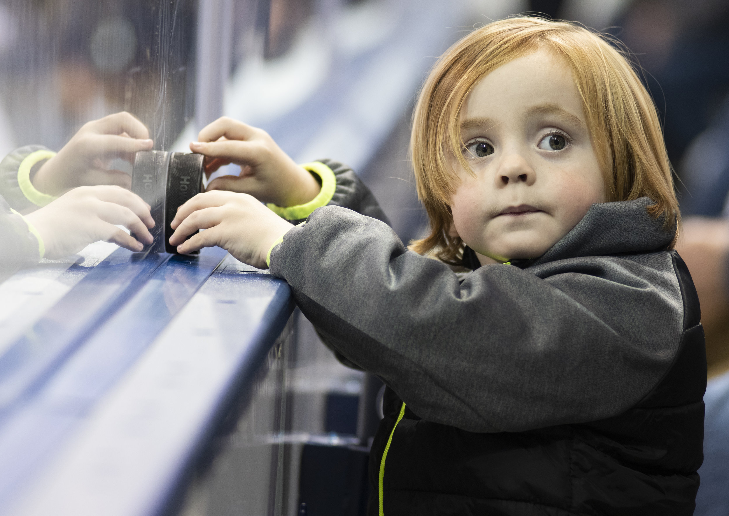 A young fan plays with a puck during game against Arizona State at Pegula Ice Arena on Saturday, Nov. 3, 2018. The Nittany Lions fall to Arizona State 4-3 in overtime. | Photo by: Noah Riffe