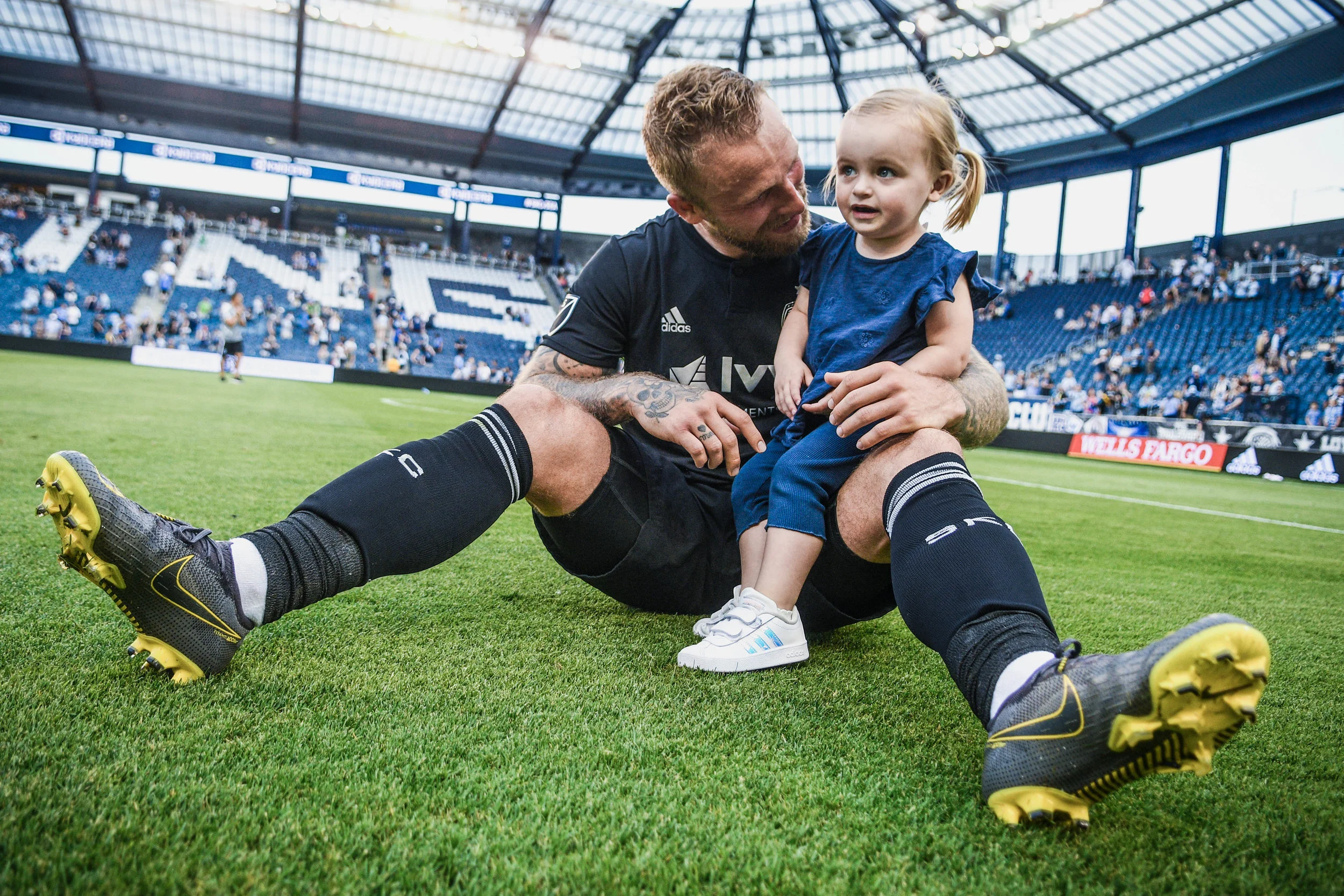 Johnny Russell (7) hugs his daughter after Sporting Kansas City’s match against Seattle Sounders FC on Sunday, May 26, 2019 at Children’s Mercy Park in Kansas City, Kansas. Sporting defeated the Sounders 3-2. (Photo by: Noah Riffe)