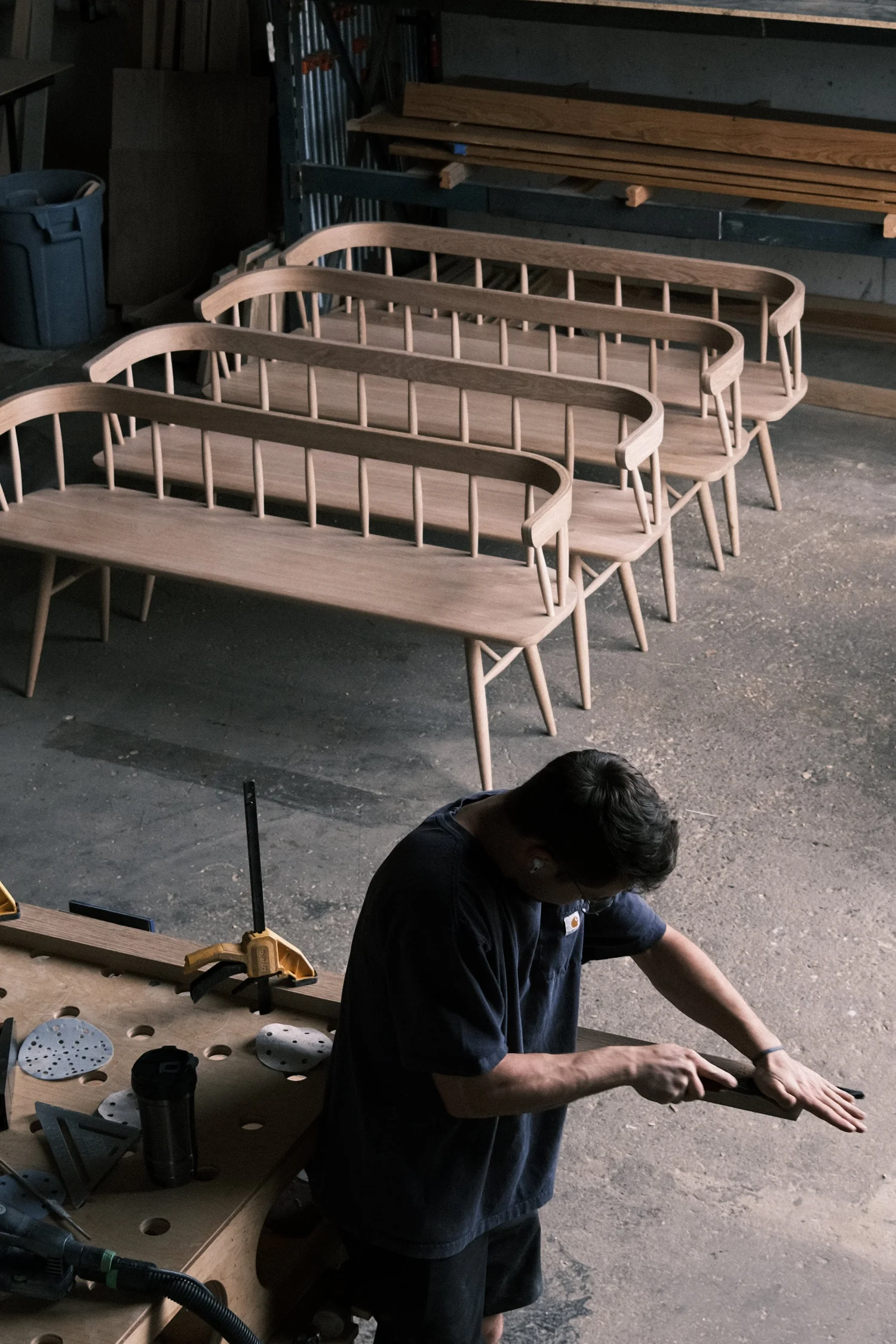 Hand-finishing white oak spindle-back benches for Okesutora in the PhillBuilt shop
