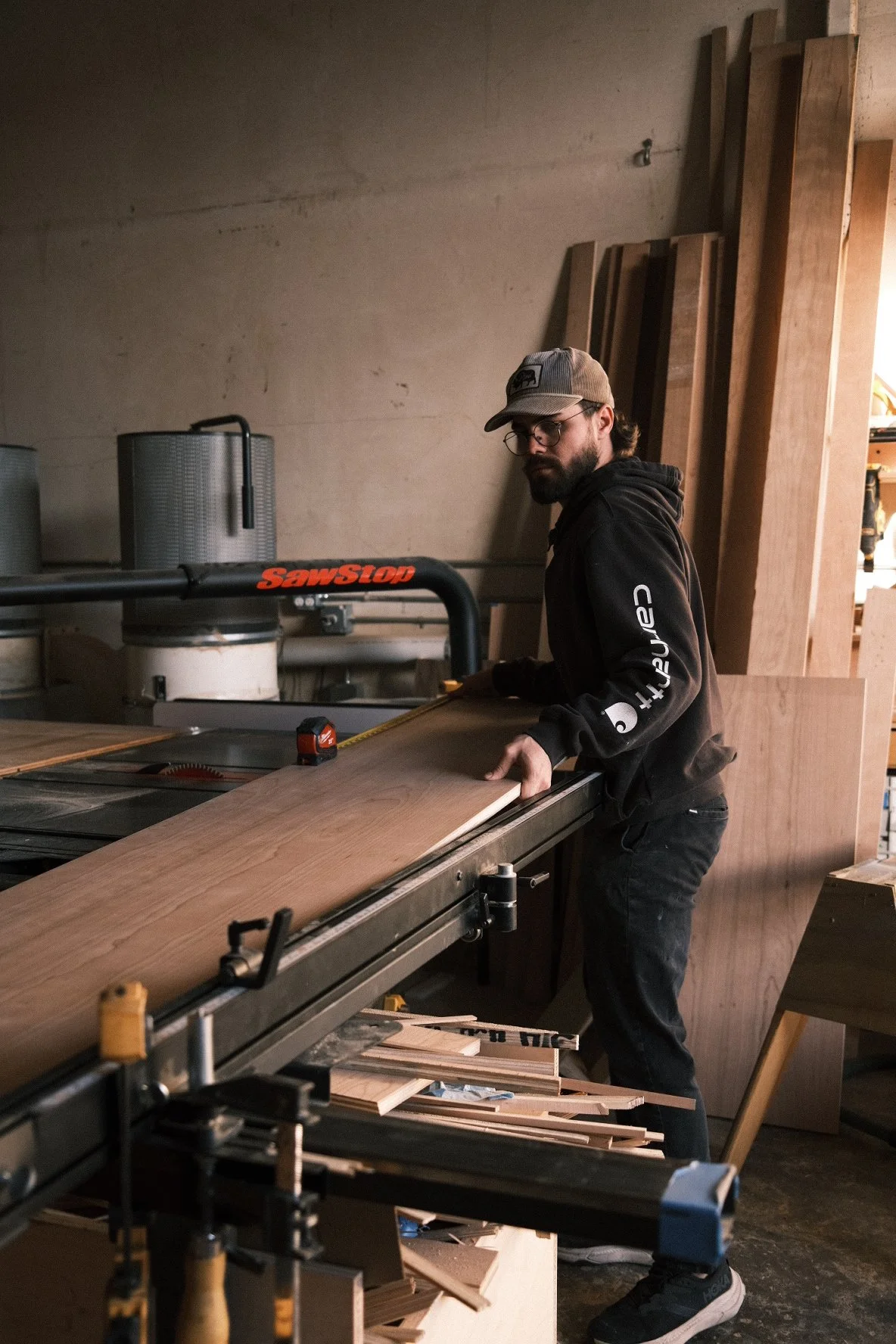 Man Cutting on a table saw. 