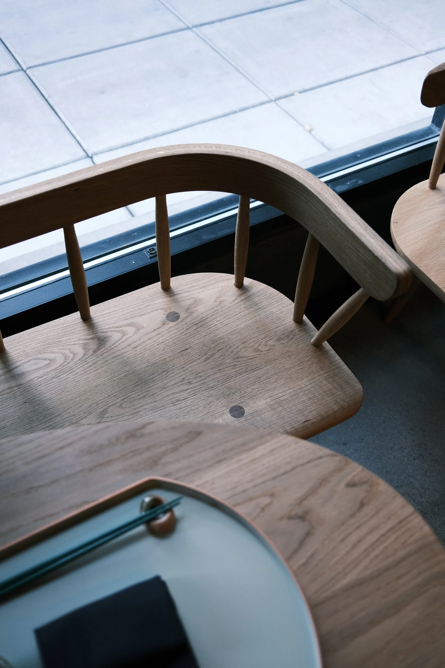 White oak spindle-back chair with sculpted saddle seat and wedged through-tenons at Okesutora