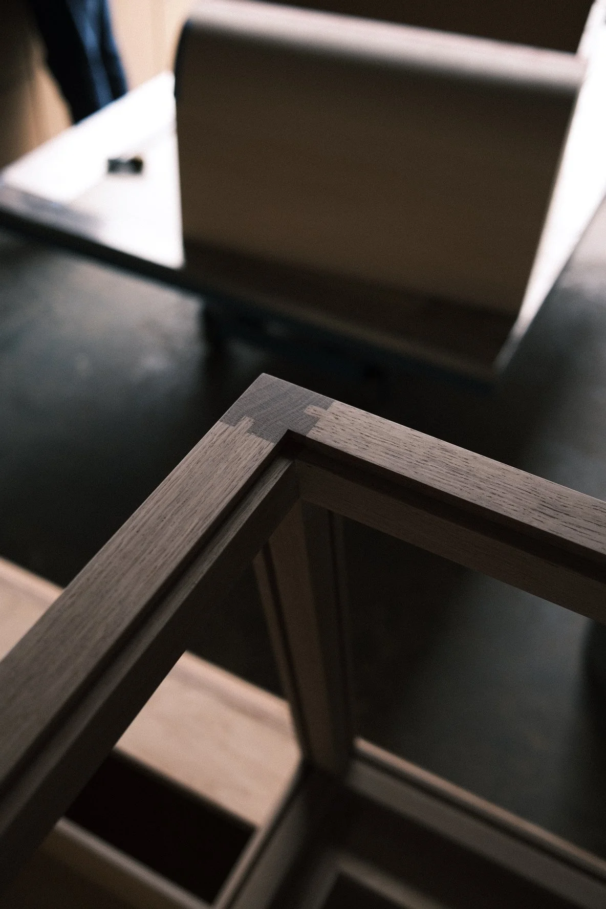 Mitered white oak frame corner, café millwork joinery detail