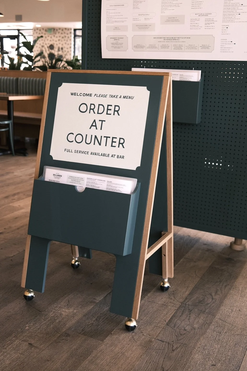 Painted A-frame order sign with white oak frame and menu pocket at Selland's Market-Café, Broadway