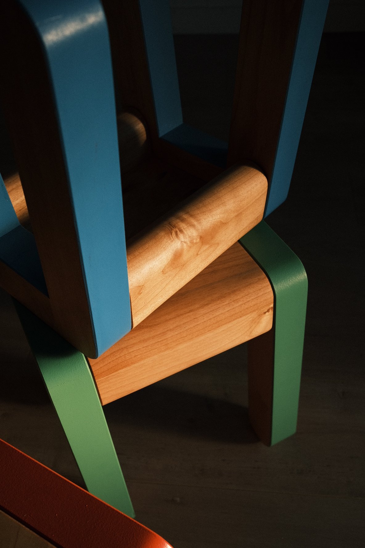 Set of handmade wooden kids stools in primary colors