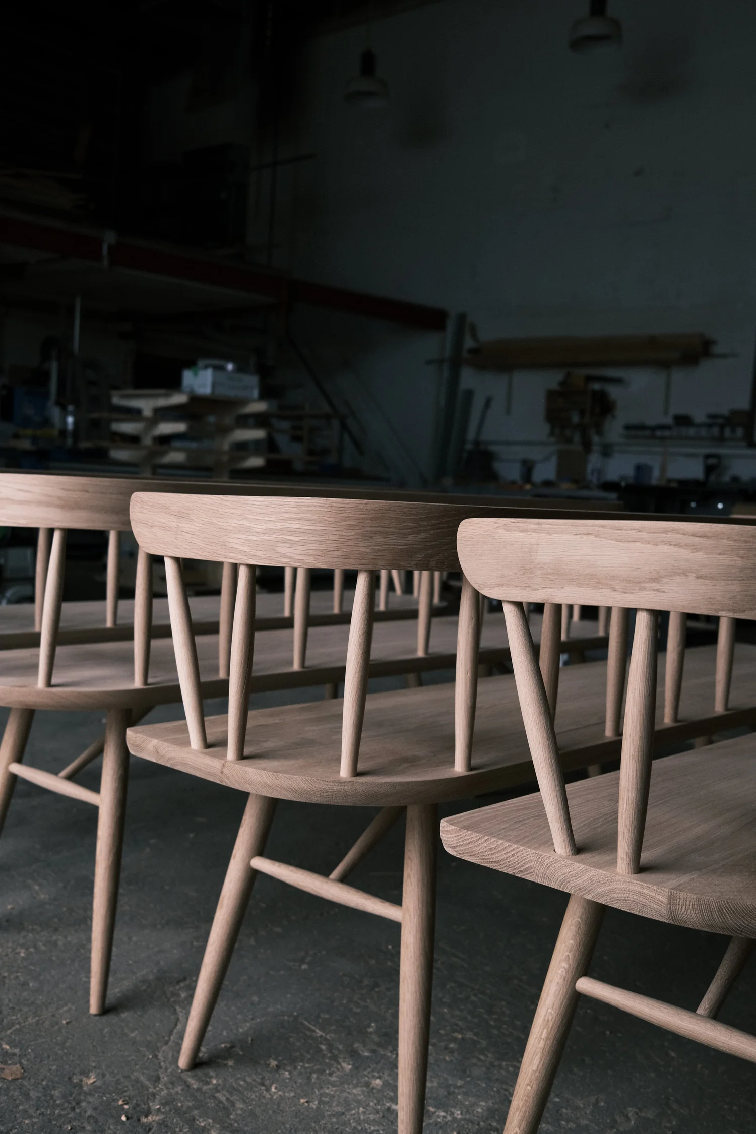 White oak spindle-back chairs with curved crest rails awaiting delivery to Okesutora
