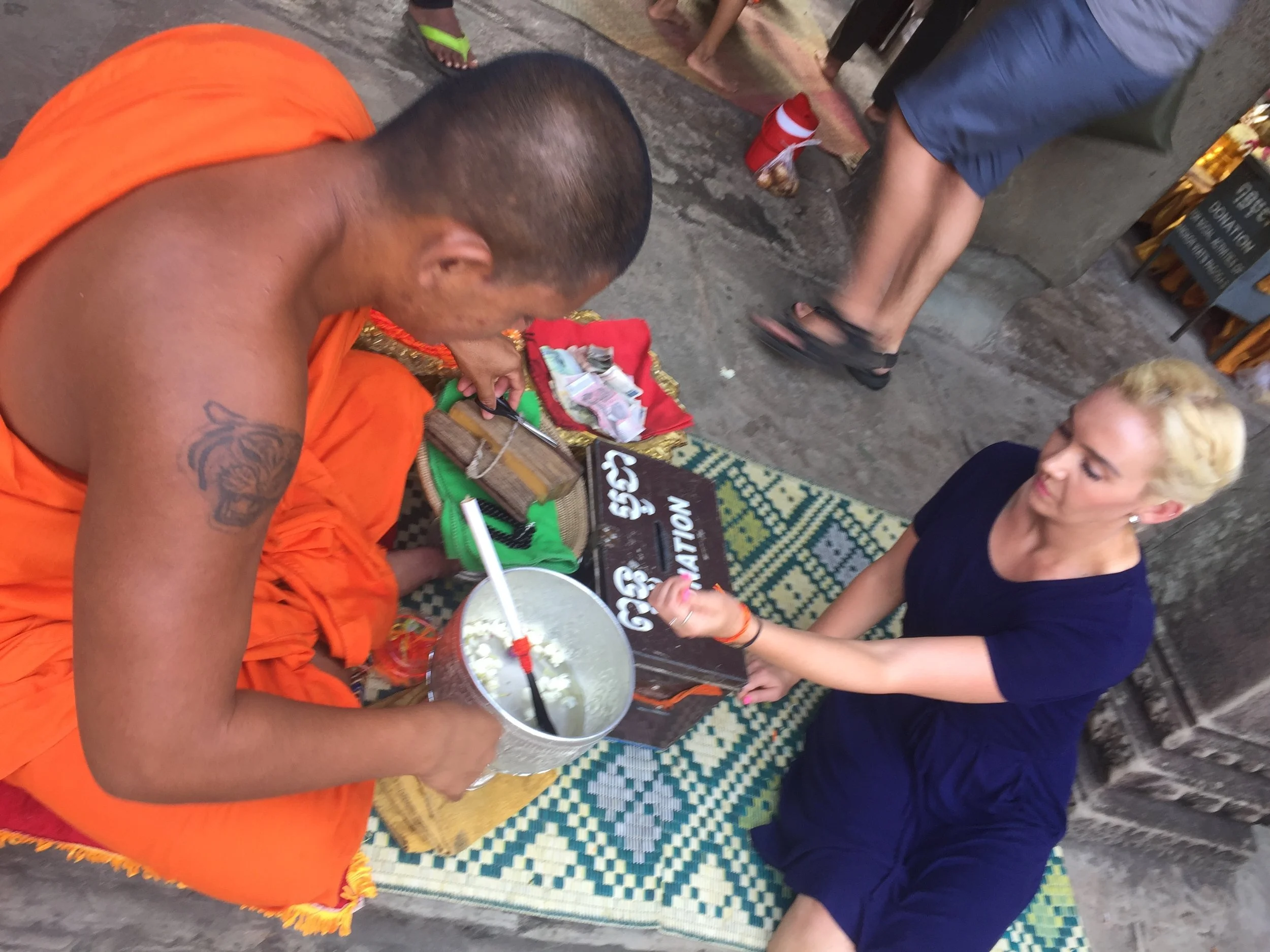  Getting blessed by the Buddhist monk.&nbsp; 