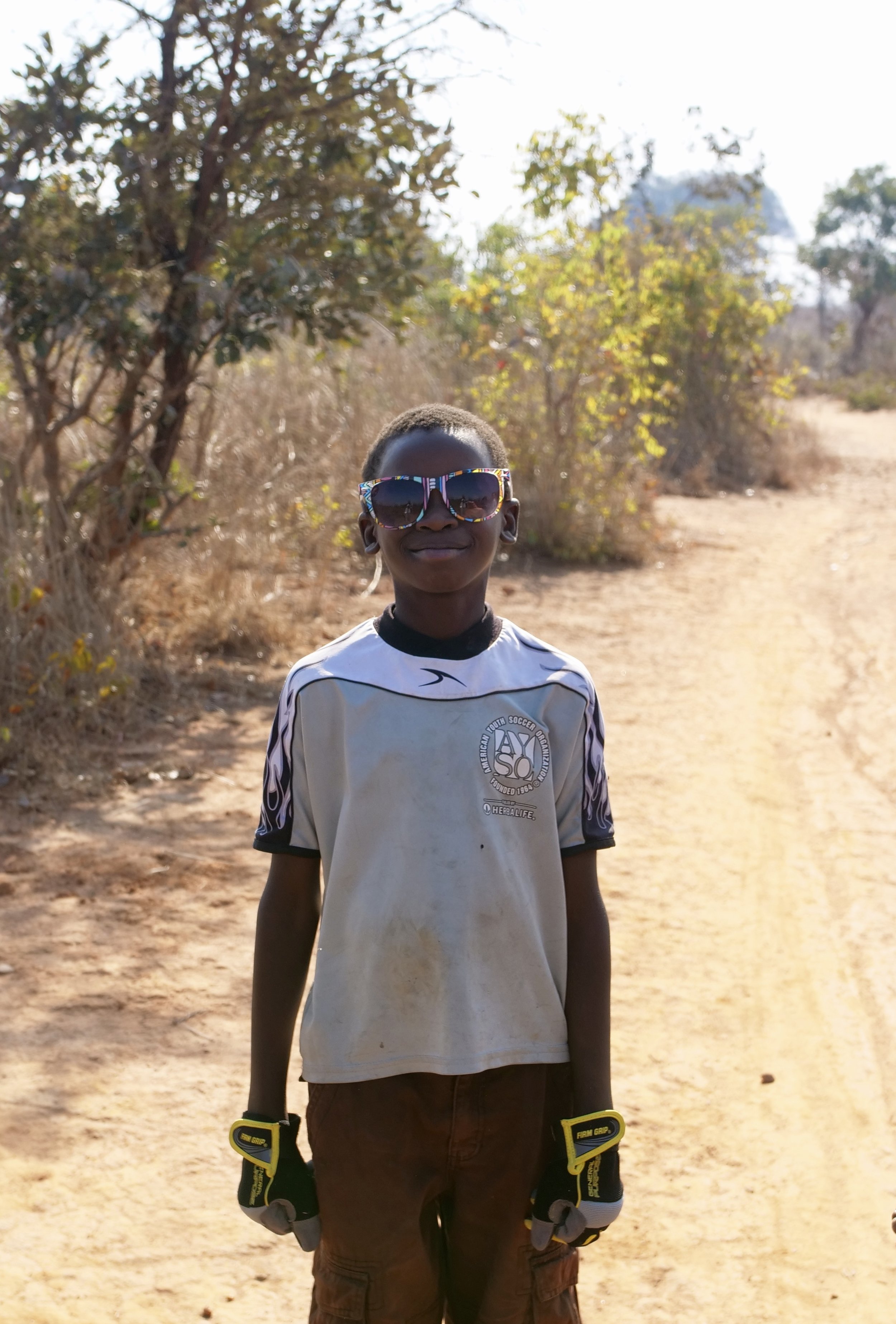  What do you get when the coolest kid in the Zambian bush hijacks some foreign goods? An even cooler kid. :) Zambia, Africa.&nbsp; 