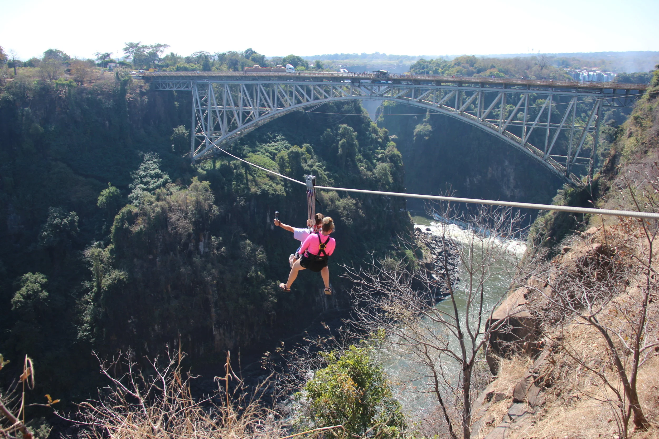  Ziplining over Victoria Falls. Need a little bigger rush? Try bungee jumping off the bridge in the background. Contact me to plan your trip today.&nbsp; 