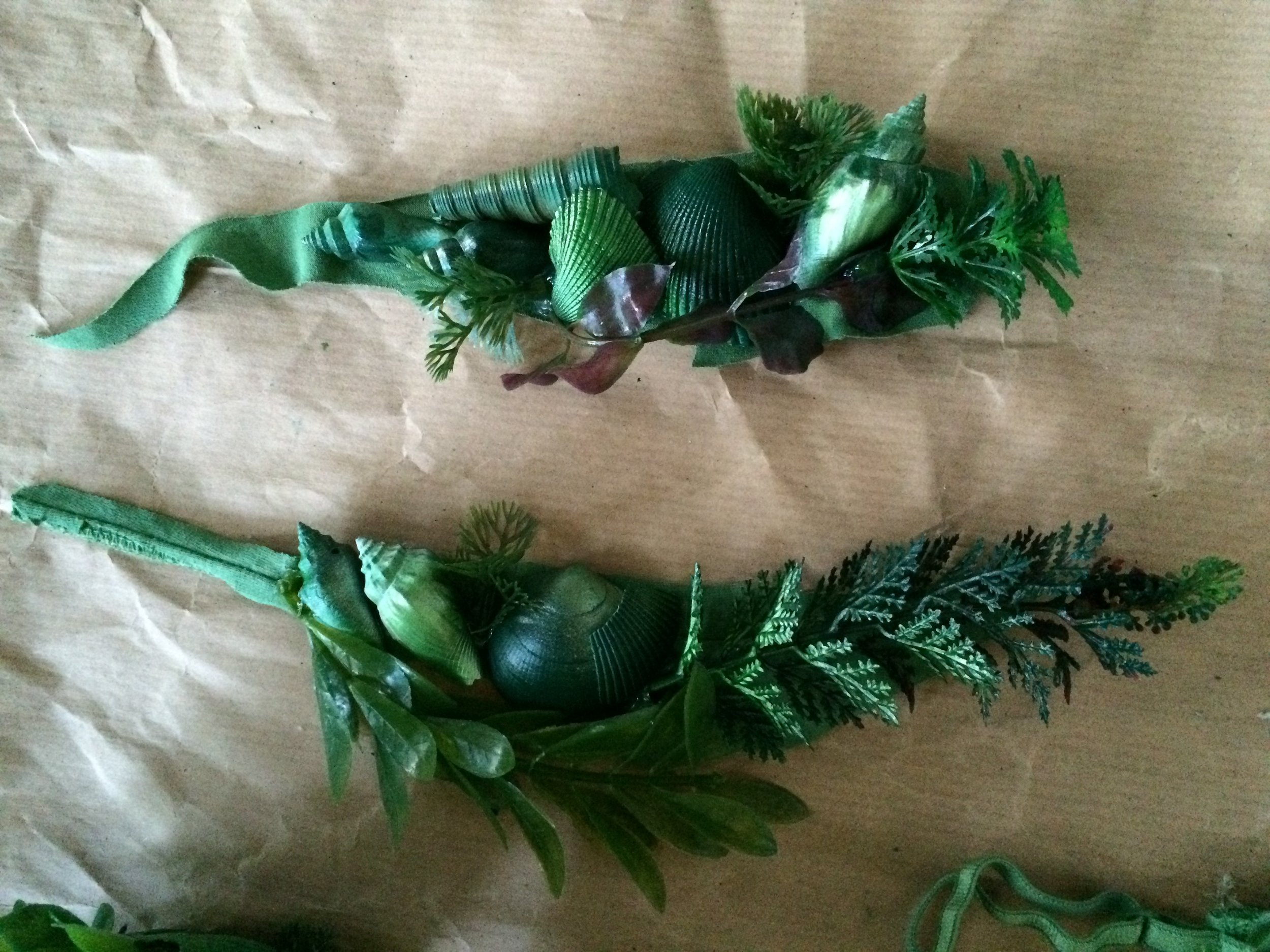 Shells and underwater greenery (read: aquarium plants spray painted to within an inch of their plastic lives)