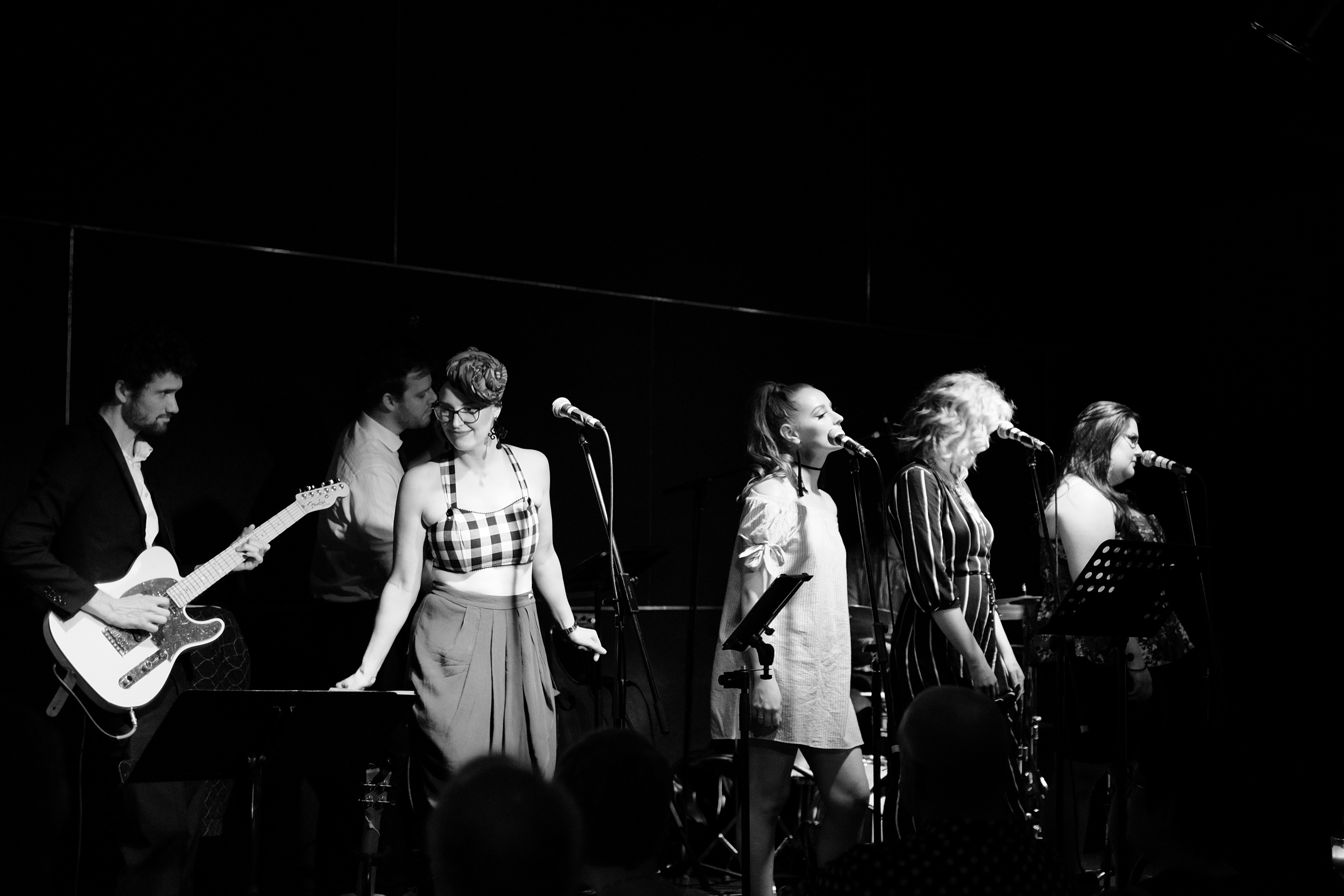 Original gig with a giant scarf attacking my head, I seem untroubled. Photo by John Lambert Gordon