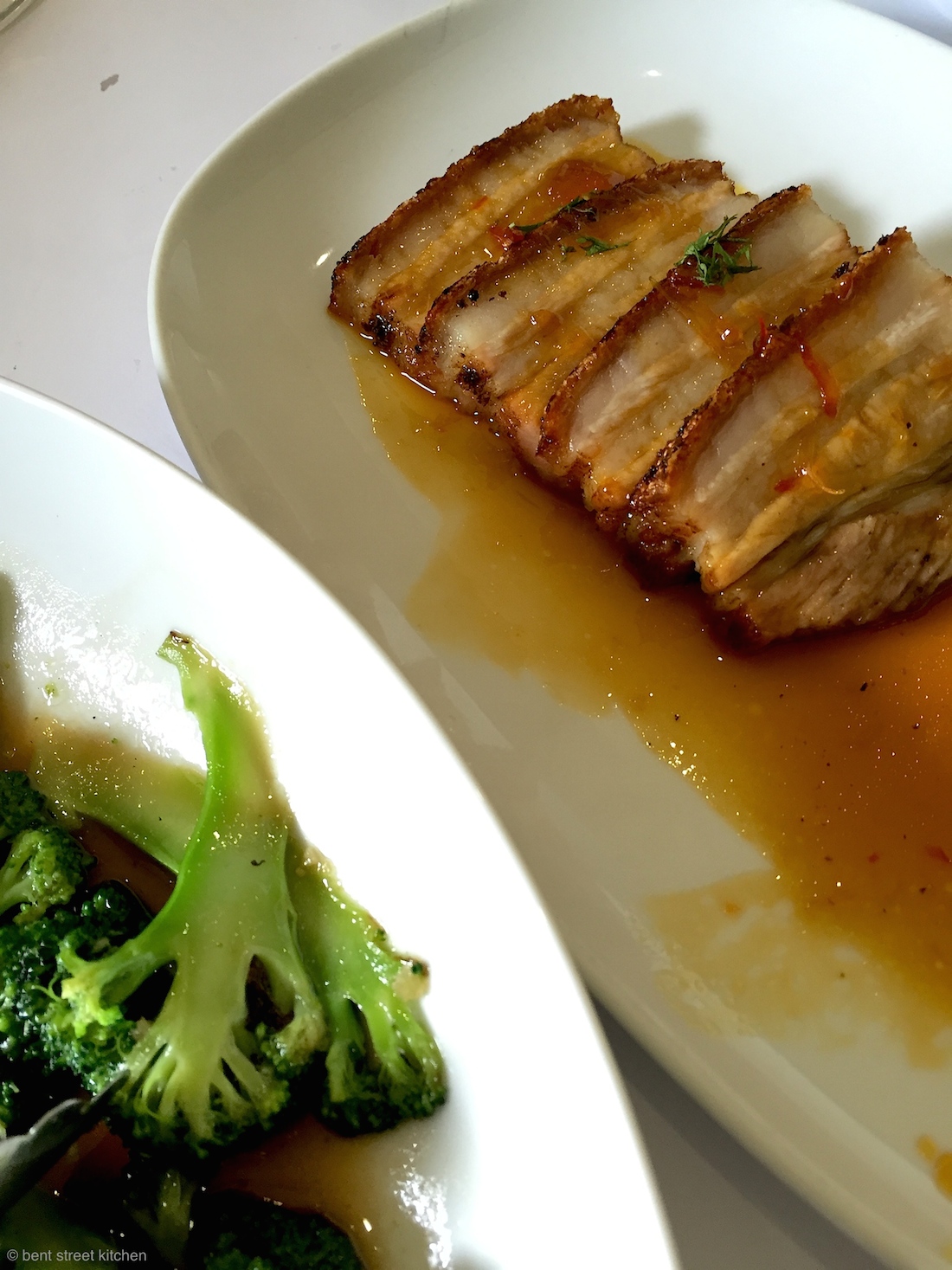 Barossa Hampshire pork belly with ginger and orange sauce and stir-fried seasonal vegetables with garlic & fish sauce