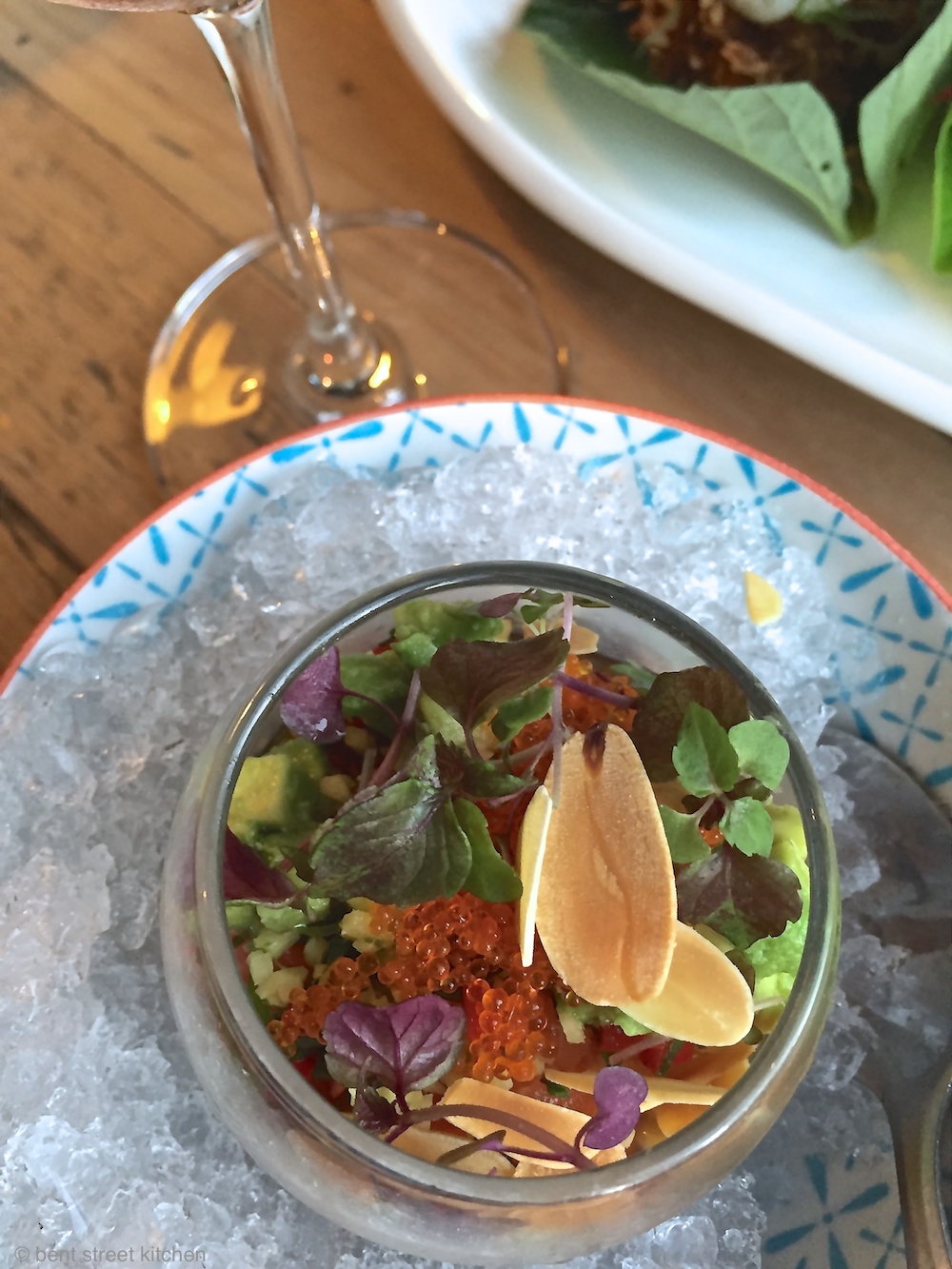 salmon ceviche with avocado, ponzu, flying fish roe, truffle oil & shiso