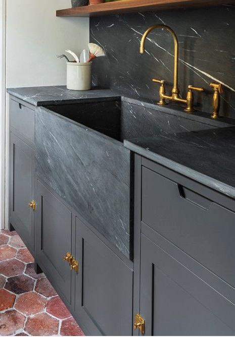3. Sinks + Countertops + Splashes While brass has been trendy for a year or so now, we’re loving it combined with black on black on black. Can’t afford a black marble sink? Doing a black granite undermount can achieve the same look as long as you use black cabinetry, countertops and backsplash.