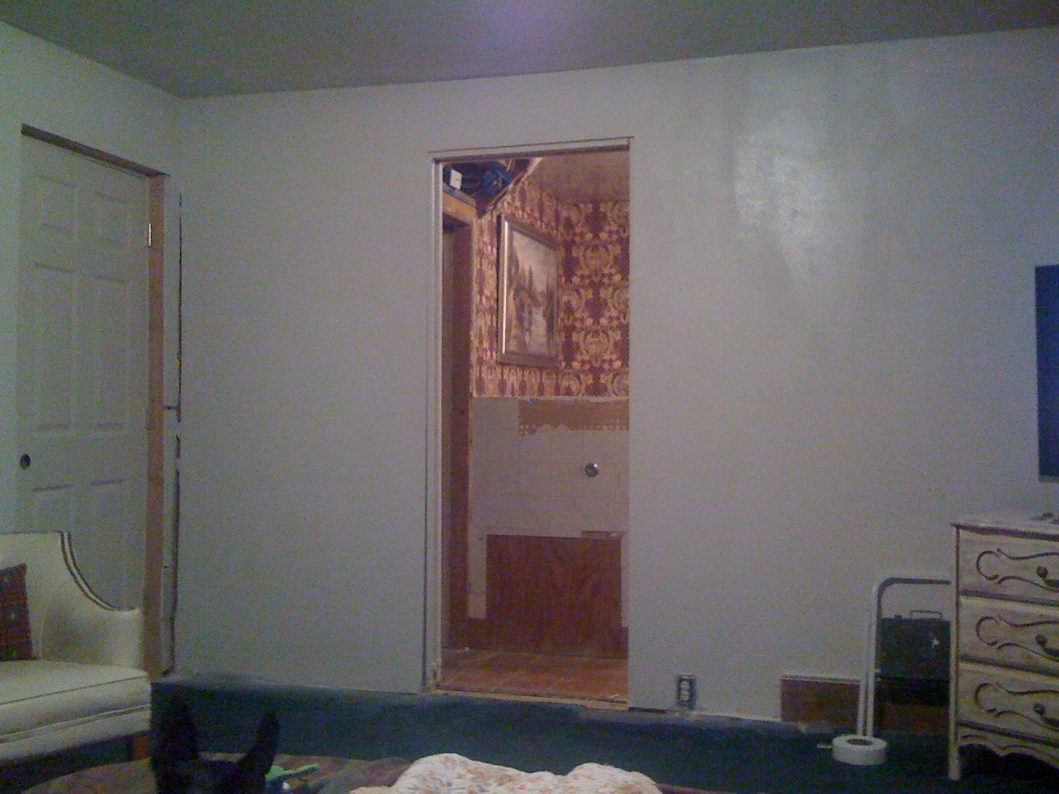 New pocket door entrance to master bath. This wall used to be closed off. New bedroom entry door to the left.