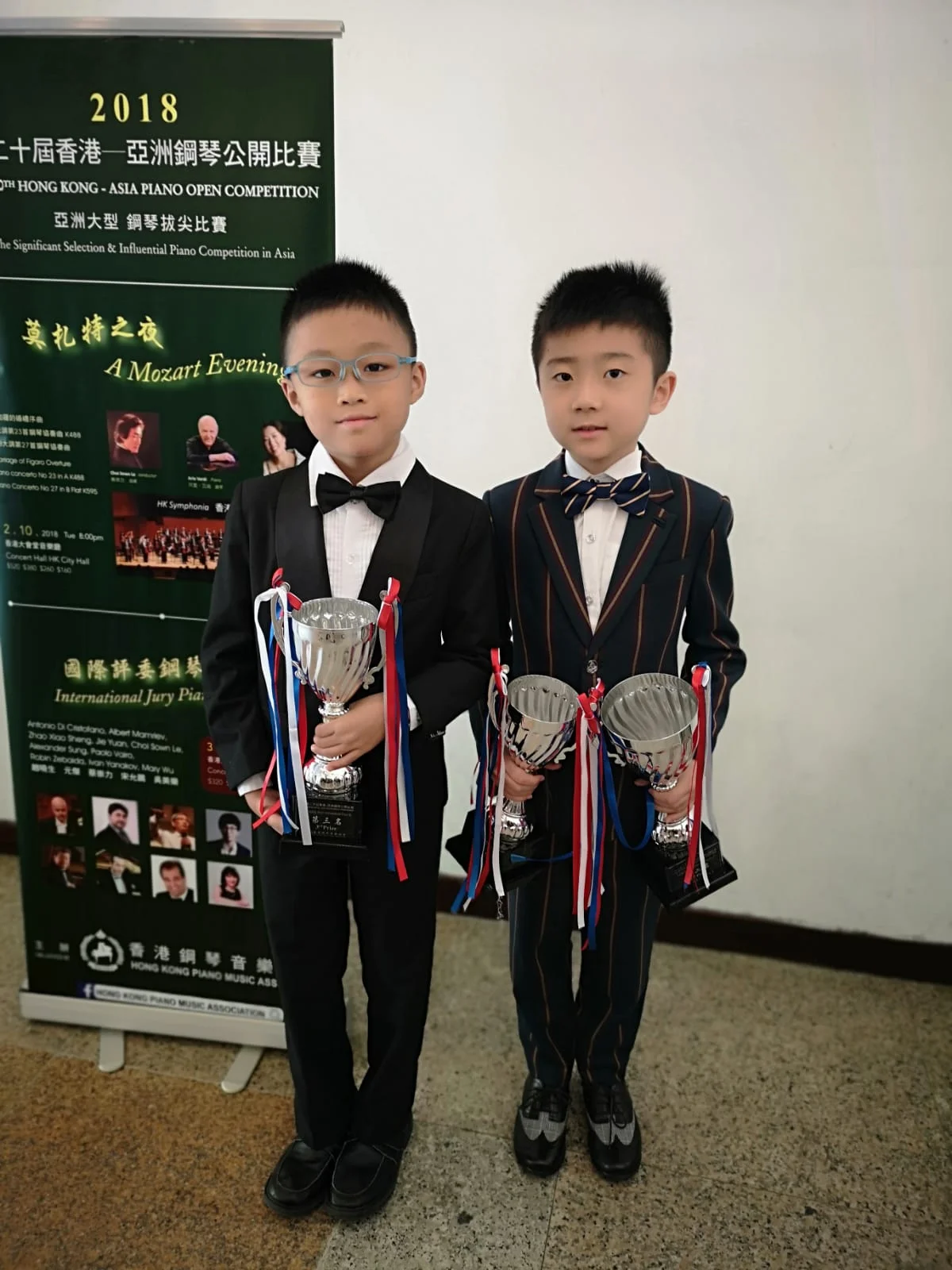 Nicholas Chin (left) and Cao Jun Wei (right) with their trophies.