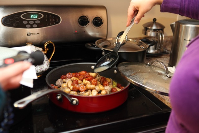  Continue cooking on low heat covered for about 45 minutes to let the flavors meld.&nbsp;Add spoonfuls of the broth that was created when you boiled the beef to keep the mixture moist. 