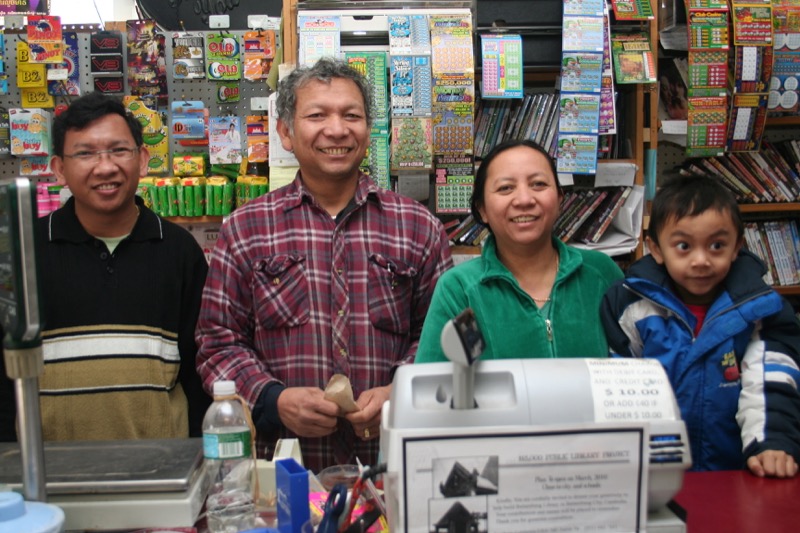 Co-owners Bunrith Pok and Mealy Khiev (pictured center) of Haknuman Meanchey Asian Market.