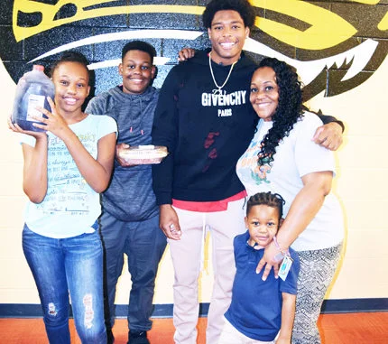 Jacksonville Jaguar Cornerback, Jalen Ramsey snaps a picture with a local Springfield family who he gave a Thanksgiving day meal.