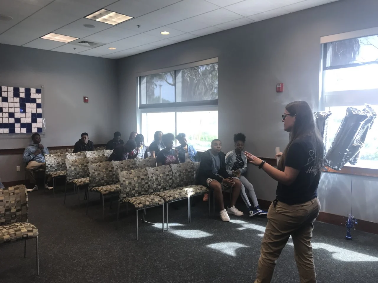 Tipping The Scales Boys & Girls Club Students listen to a University of North Florida representative