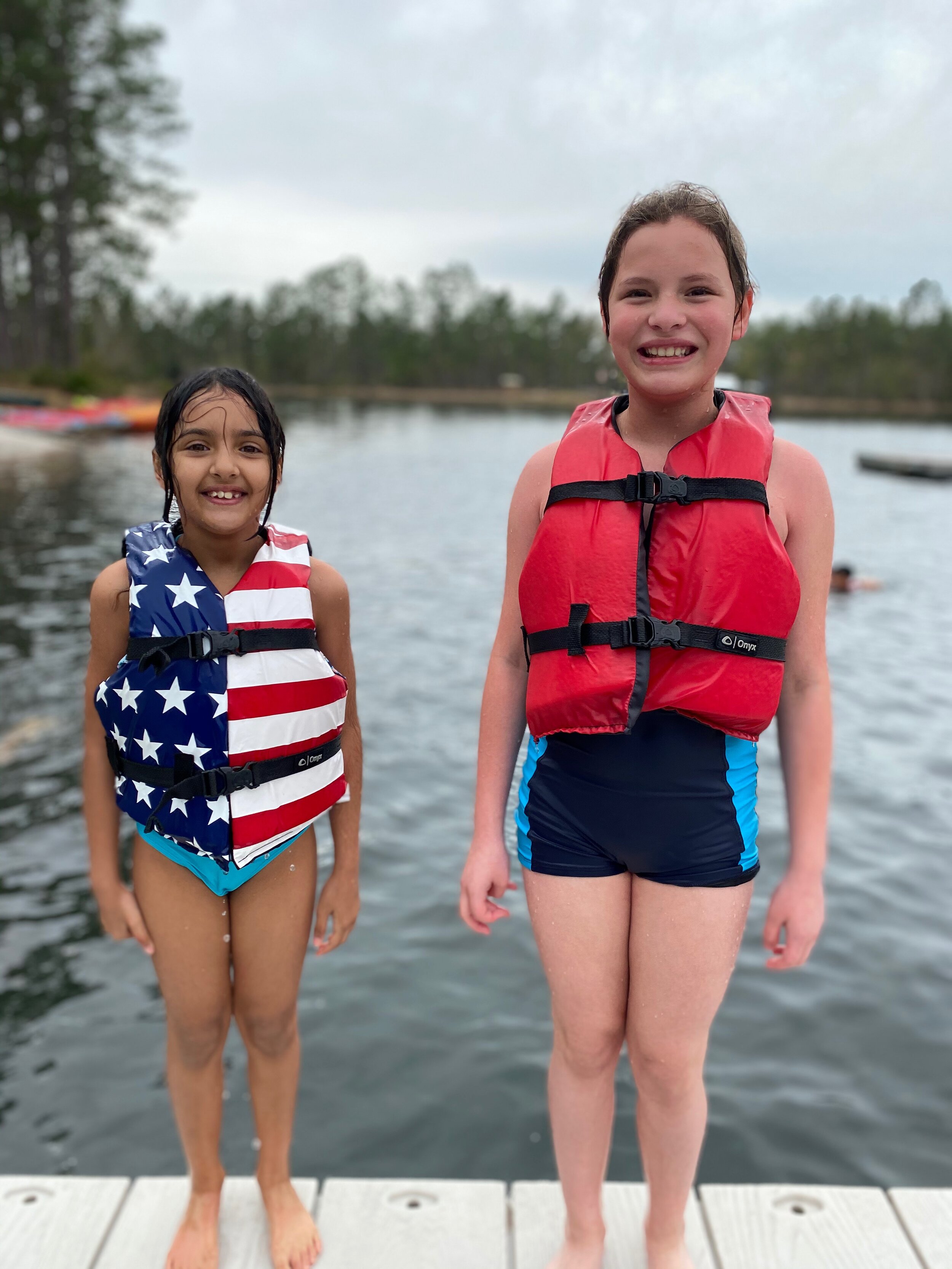 Girls on the doc with lifejackets.JPG