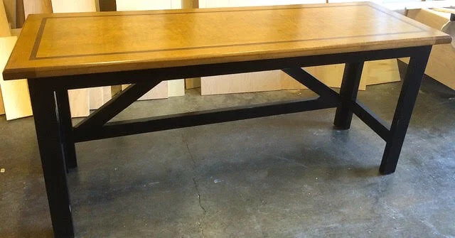 Custom table with black legs and inlayed wood top