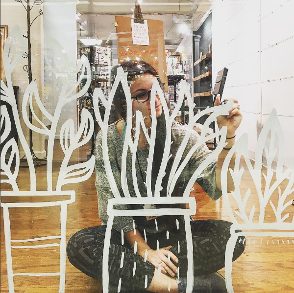 Our window design incorporated hand drawn plant figurines.