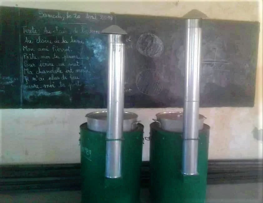 Volunteers use cook stoves like these to prepare breakfast for students each day.