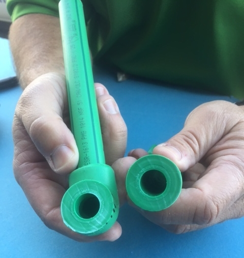 slicing through the fused joint of the aquatherm pipe reveals that the elbow and pipe were transformed into one solid piece of pipe during the heat fusion process.
