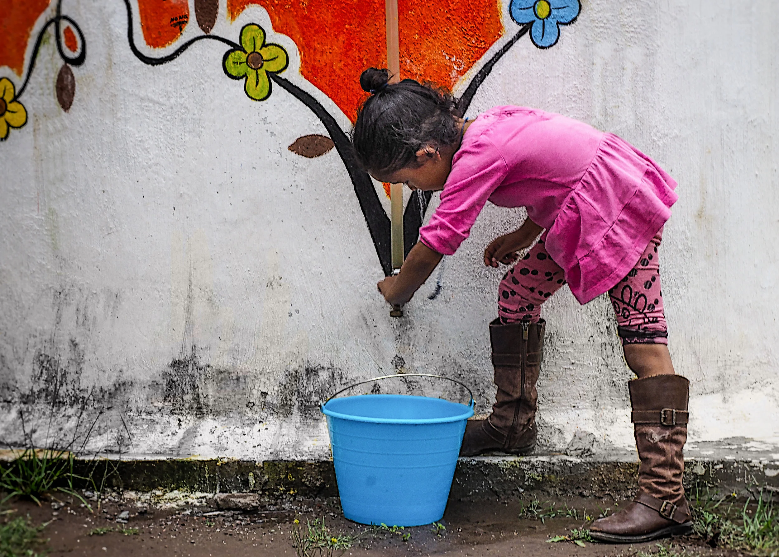 Taking water from her cistern.