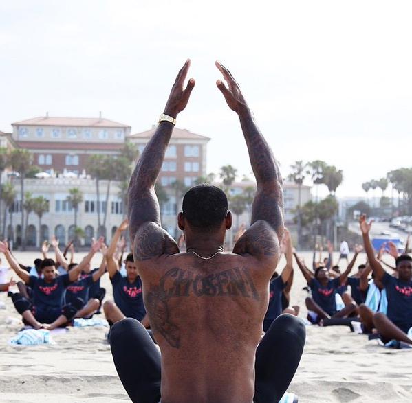 LBJ leading Yoga at a Nike Basketball Camp.