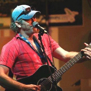 I'm a singer/songwriter/performer/actor and cartoonist. I also design and build bamboo microphone stands. "Bobby Bamboo" mic stands. I started out a drummer. In the fifth grade I got a three piece kit for Christmas. I taught myself by playing over my dads' bop records. Then in ninth grade, a friend GAVE me a Silvertone acoustic/electric guitar, FOR FREE!! So I started writing songs. 