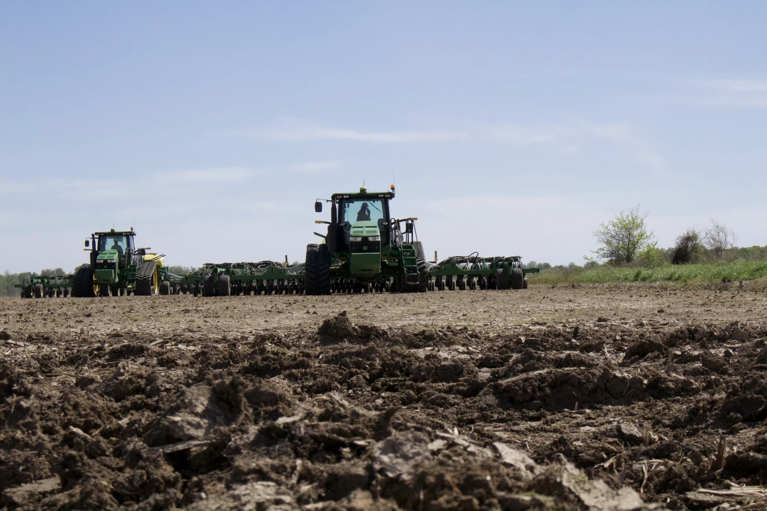 Tractors planting rice Photo Credit: Morgan Baugh