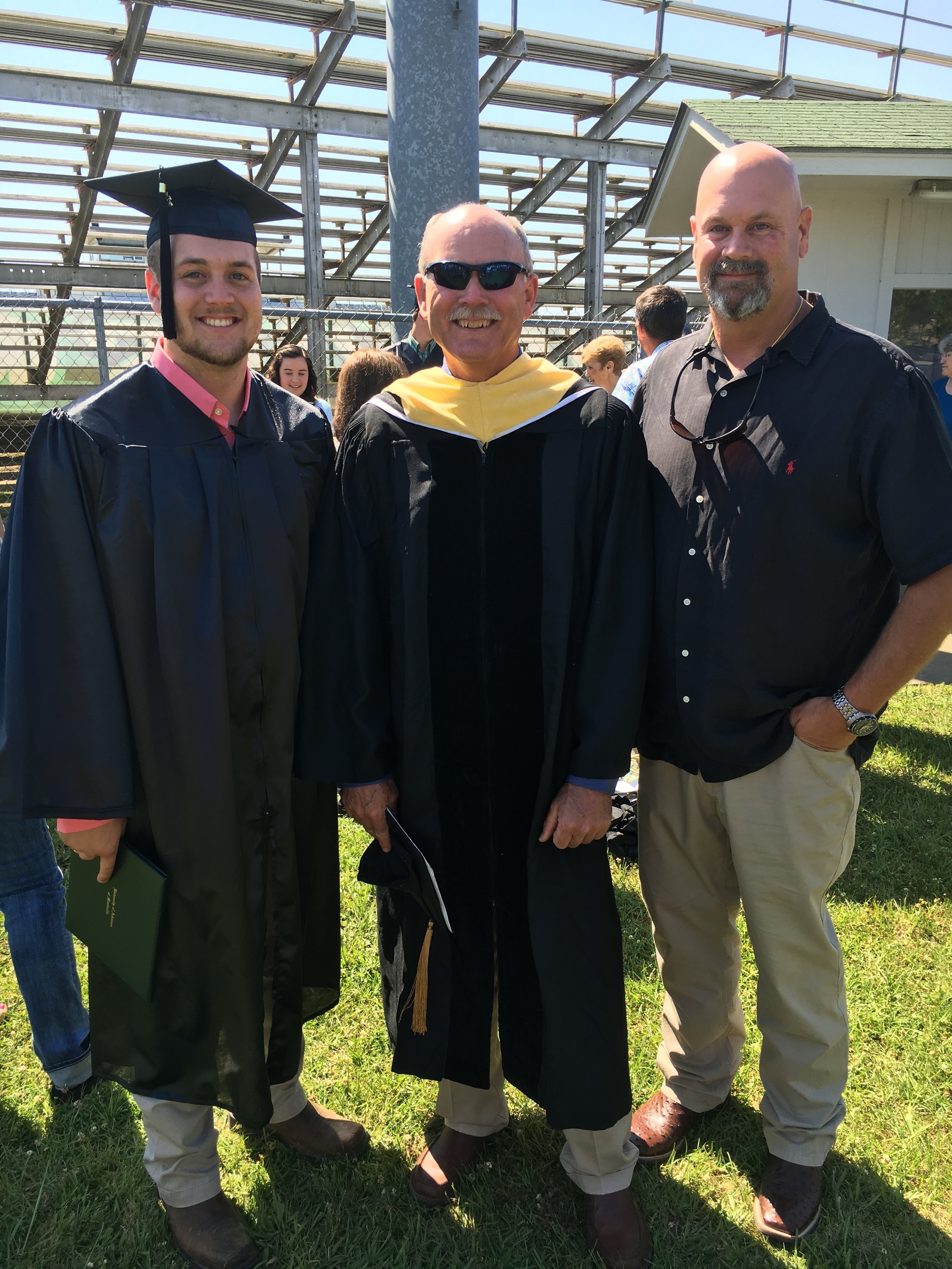 Layne and Matt Miles with a professor who taught them both