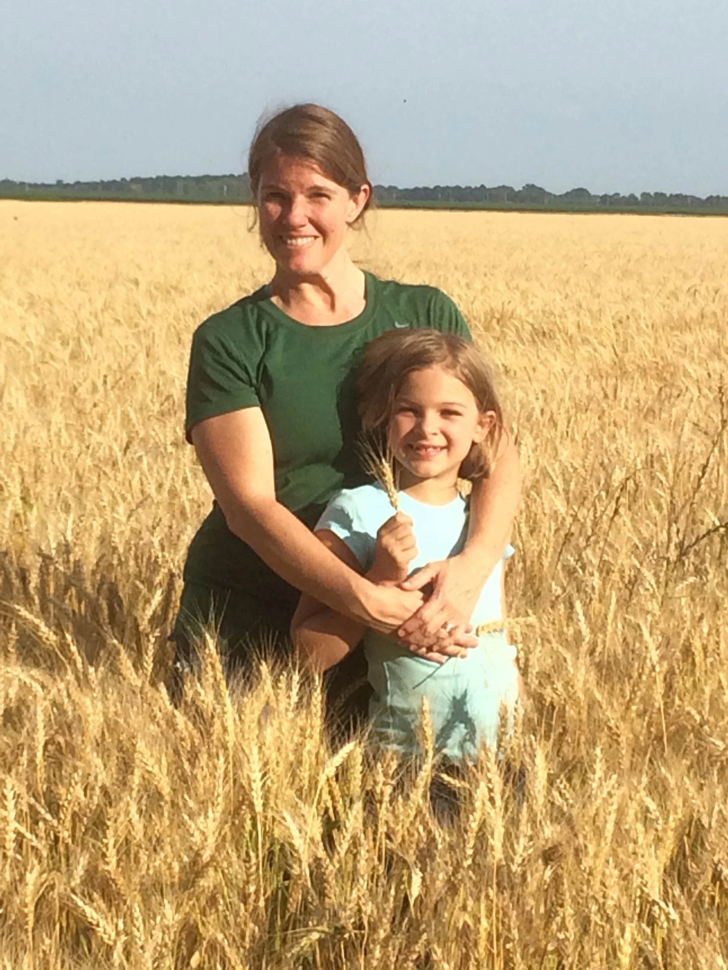 my daughter and me in a wheat field ready for harvest