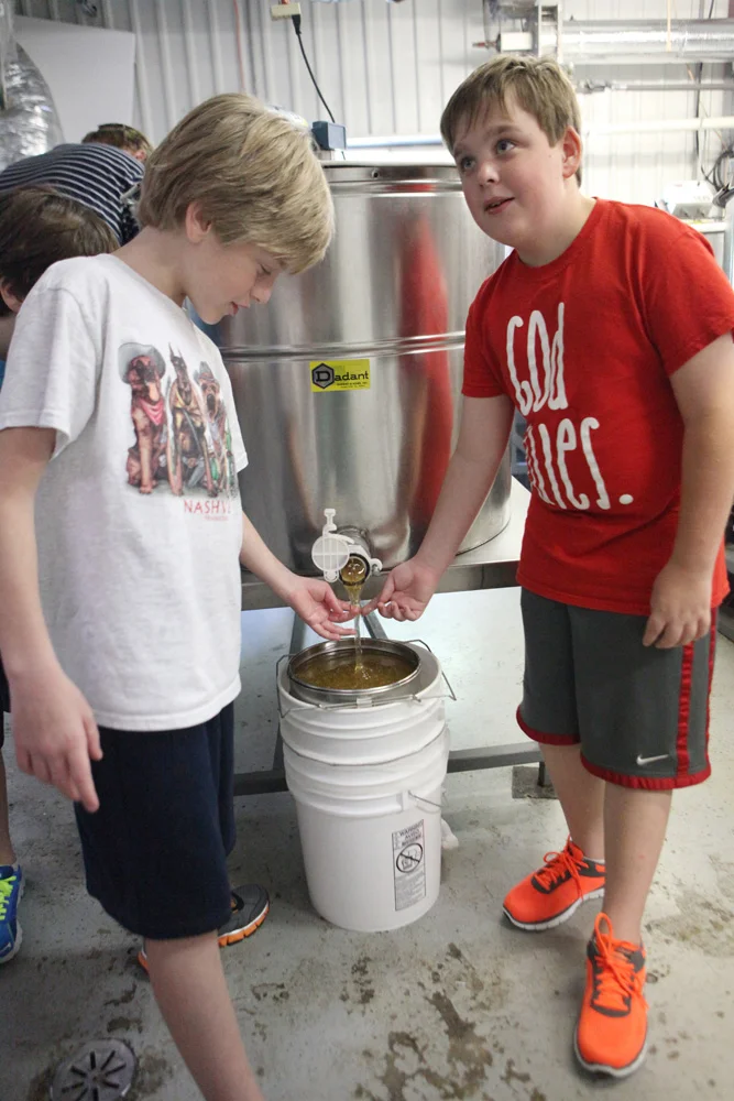 And, that's basically it! From there, the honey is ready to enjoy. It can be poured into smaller containers and will never spoil. It will eventually crystallize, but can be heated gently to return it to its liquid state. We couldn't wait and sampled it every chance we got!