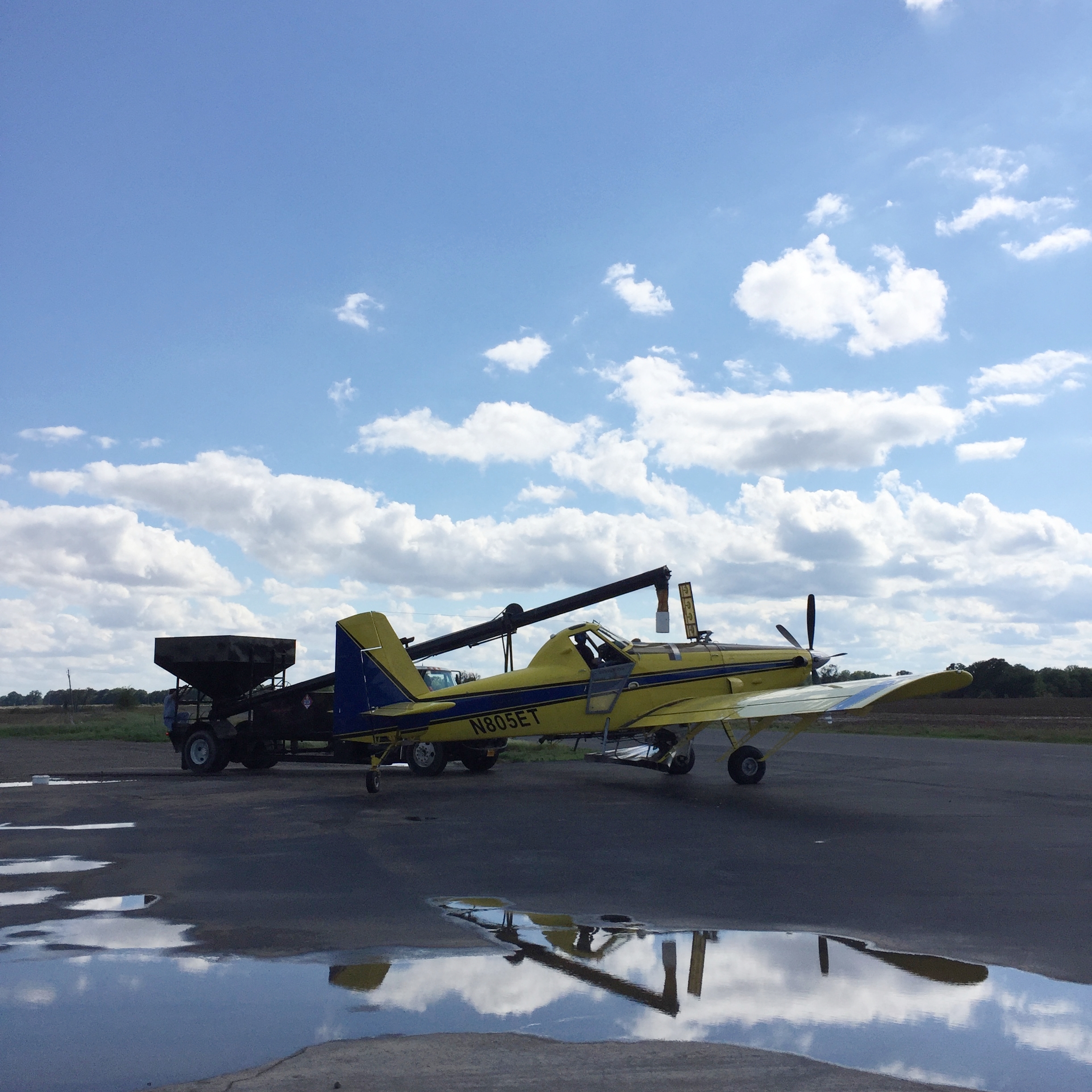 An ag plane being loaded with fertilizer
